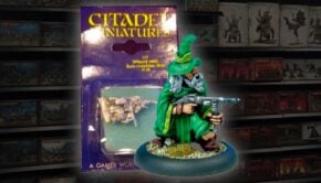 Wizard with sub machine gun paint miniature with store shelf background