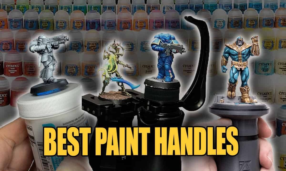 best painting handles shows various ones holding minatures with paint pots in backgournd