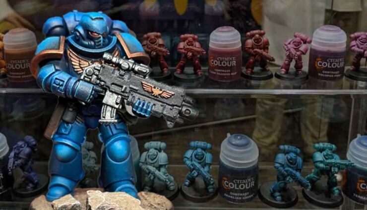 contrast paint space marine painted with bottles in background