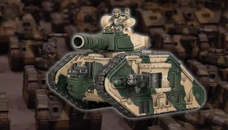 leman russ tank painted model with dozens more on table in read shaded warhammer 40k