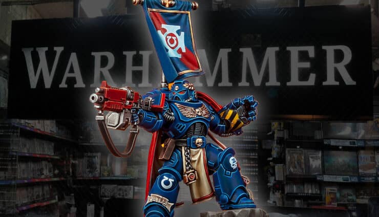 painted version of capt centos space marine with faded out warhammer 40k store in background