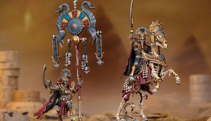 Warhammer Old World tomb kings new models revealed painted liche priests on sandy terrtain with shaded out pyramids
