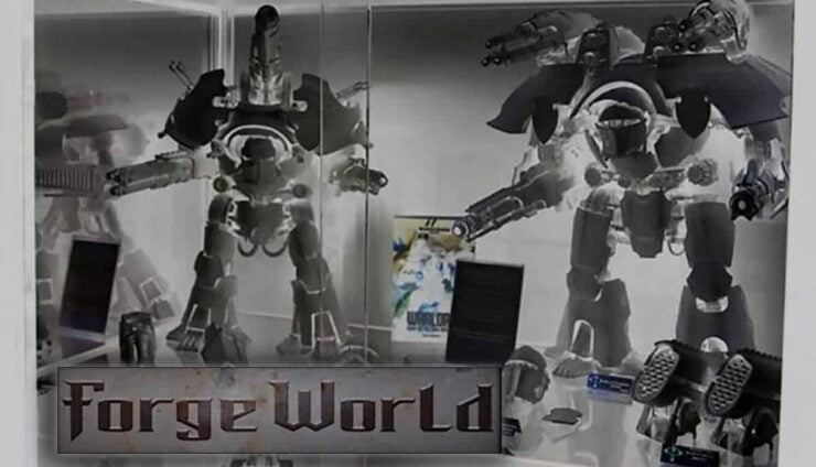 forge world large titan models assembled in a case inverse image so appear like ghosts with logo in front