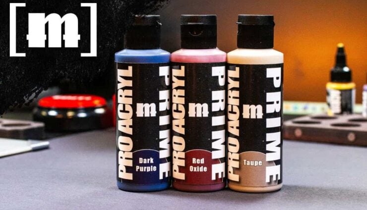 new monument hobbies pro acytl primers product shot on table with painting supplies