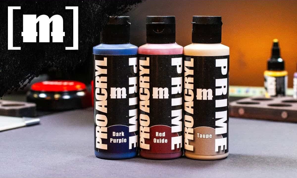 new monument hobbies pro acytl primers product shot on table with painting supplies
