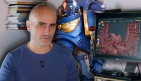 games workshop sueing ghamak image with artist 3d sculpting a miniature with space marine art behind him