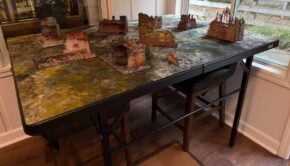 FLG warhammer gaming table set up with terrain on it