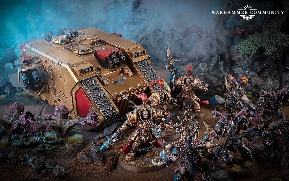 Gold Adeptus Custodes Venerable Land Raider and Custodians fighting Chaos, the Land Raider now moving to Legends