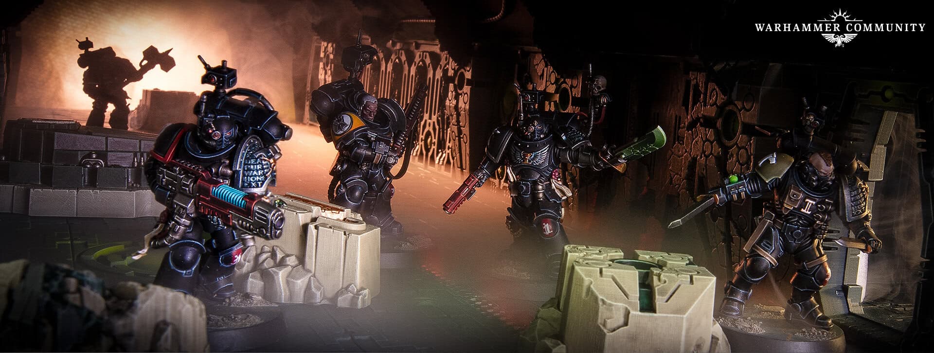 Deathwatch Kill Team miniatures on battlefield terrain