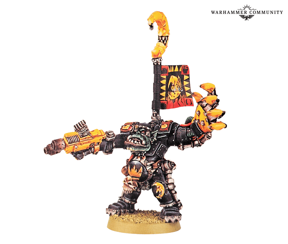 Classic metal Nazdreg Ug Urdgrub Ork warlord in yellow Bad Moons armour with a kustom shoota and banner pole