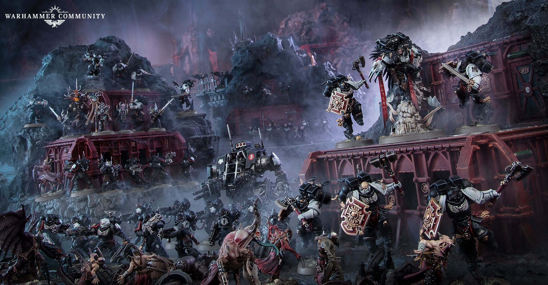 Raven Guard Space Marines in Phobos armour moving through shadowed ruins