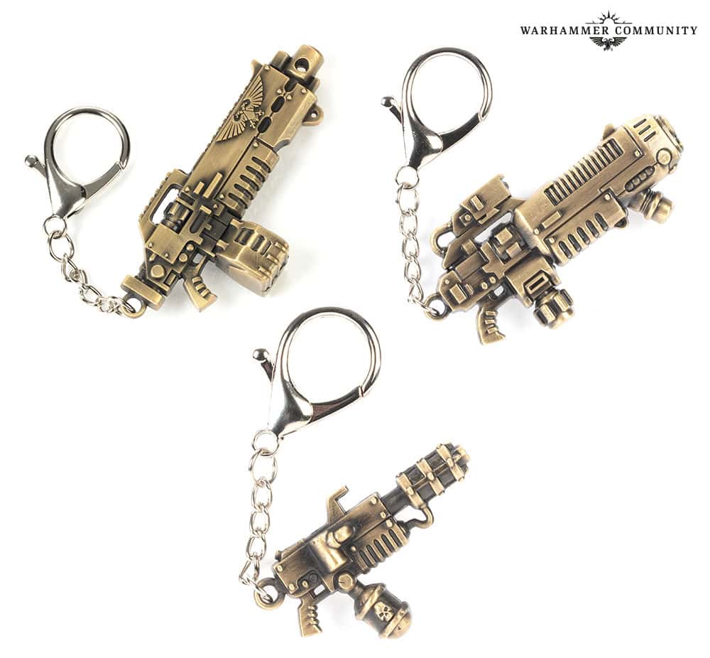 Starforged metal keyrings shaped like a plasma rifle, heavy bolt rifle and Ministorum flamer