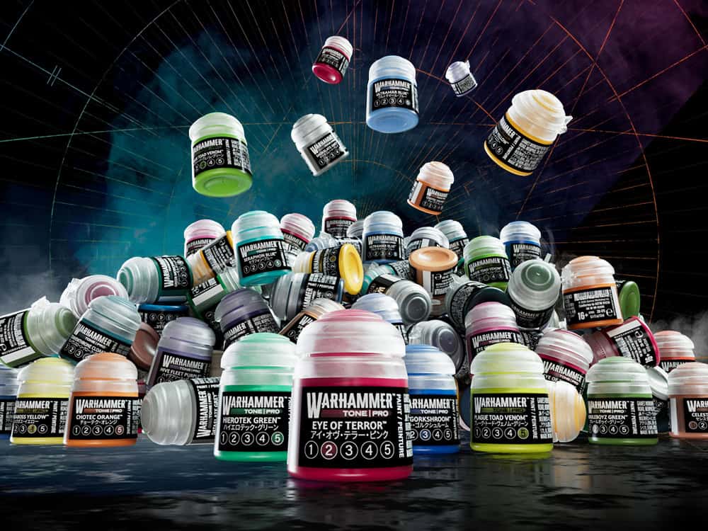 Giveaway prize display showing the full Warhammer Tone Pro paint range with dry brushes and Warhammer Pro Tools