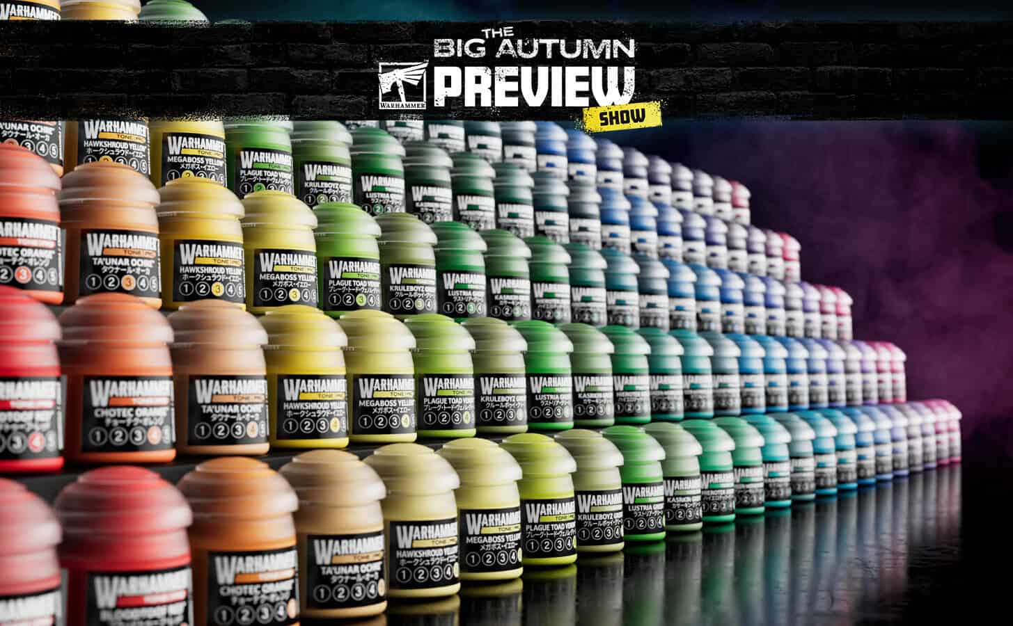 Warhammer Tone Pro paints displayed with a painted miniature alongside the new range